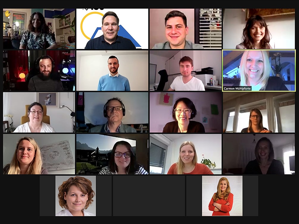 Screenshot mit lächelnden Teilnehmer/innen der Veranstaltung